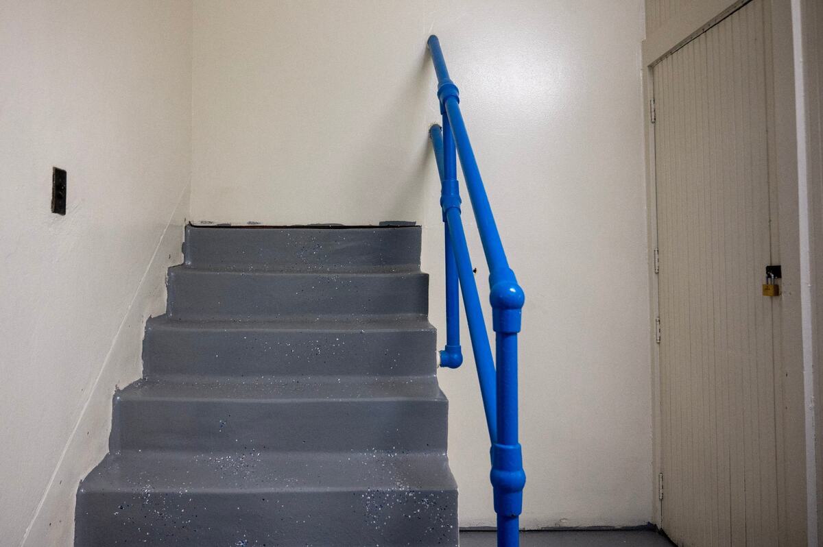 A staircase leading nowhere is seen at Central Middle School on Tuesday, April 16, 2024, in Kansas City, Kansas. It was walled off after a renovation of the school’s old gymnasium, which was repurposed to house air-conditioning units and classroom space.