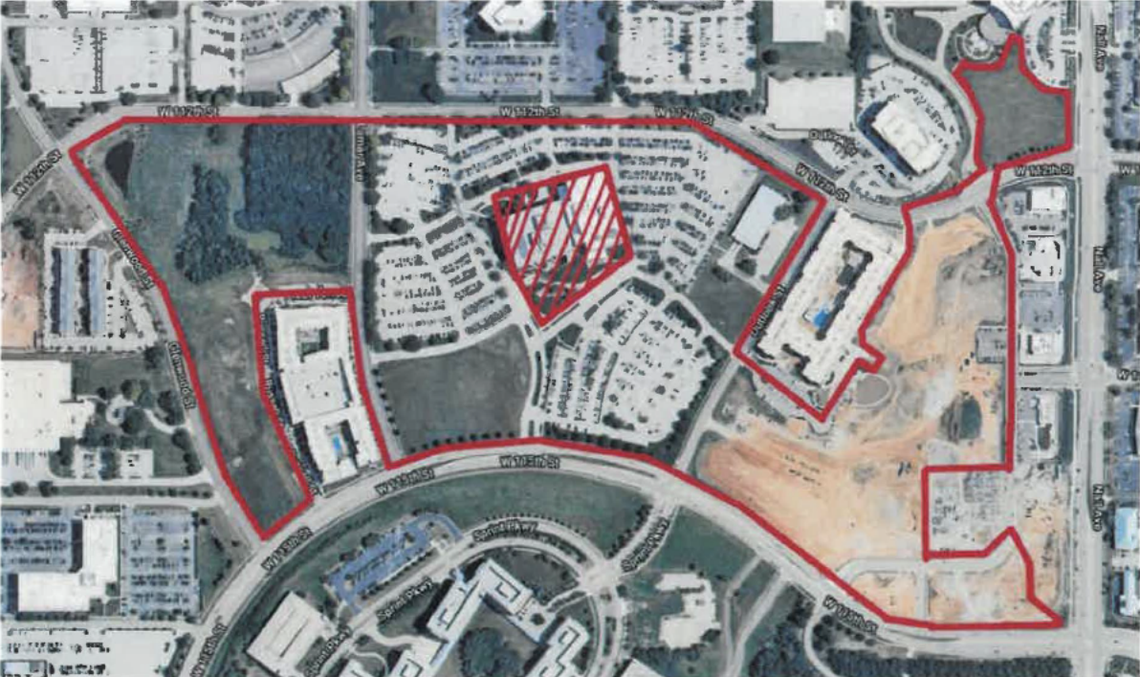 A satellite image of buildings and parking lots is outlined to depict project boundaries. 