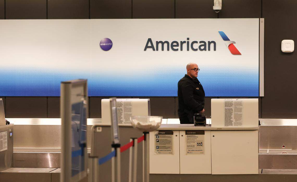 An airport security officer was on duty at the American Airlines counter Wednesday, Jan. 29, 2025, at Eisenhower National Airport in Wichita. An American Airlines flight that originated in Wichita crashed just miles short of its destination at Reagan National Airport in Washington, D.C., after it collided with a military helicopter.