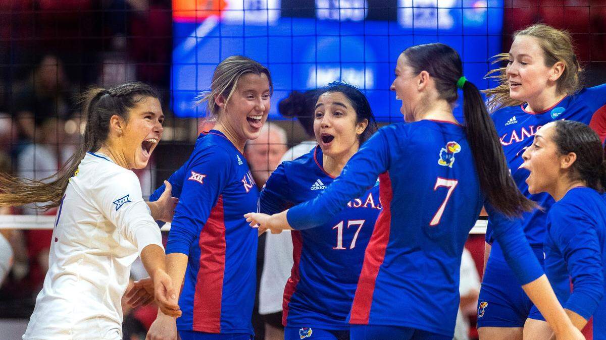 Kansas celebrates a kill by Katie Dalton against Miami during a first-round match of the NCAA women’s volleyball tournament on Dec. 1, 2022, in Lincoln, Neb.