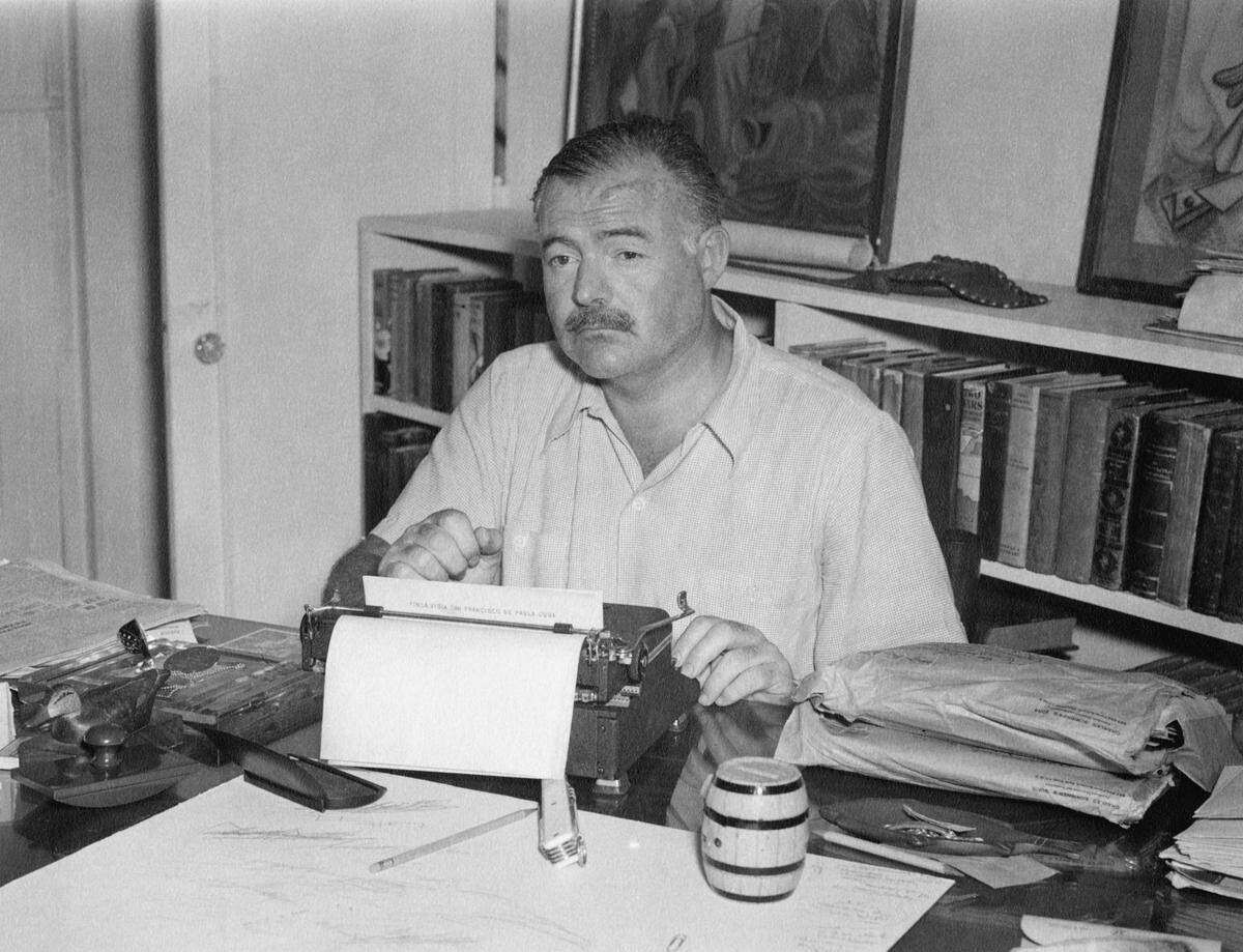 Ernest Hemingway at his typewriter in Finca Vigia, his home near San Francisco de Paula, Cuba.