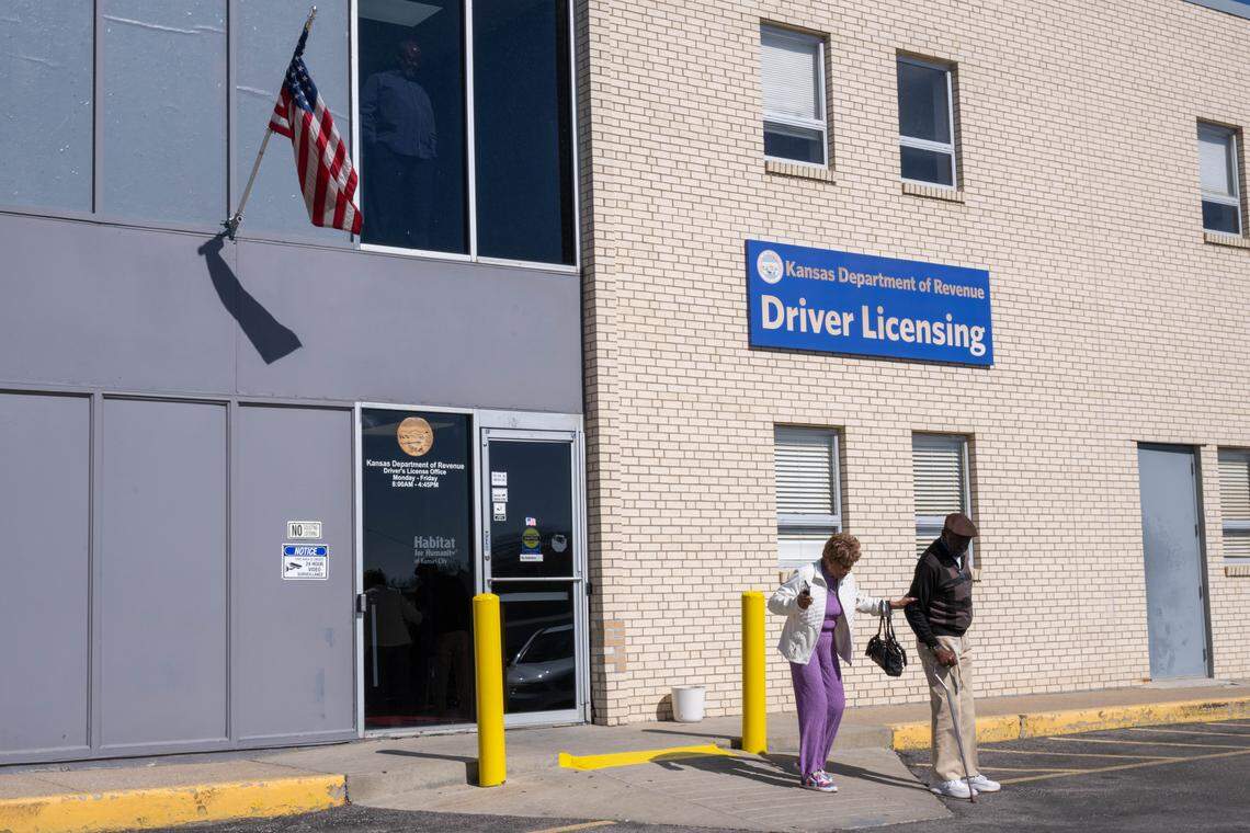 People walk out of the Kansas Drivers License Department on 18th Street in Kansas City, Kansas, on Thursday, February 26, 2026.