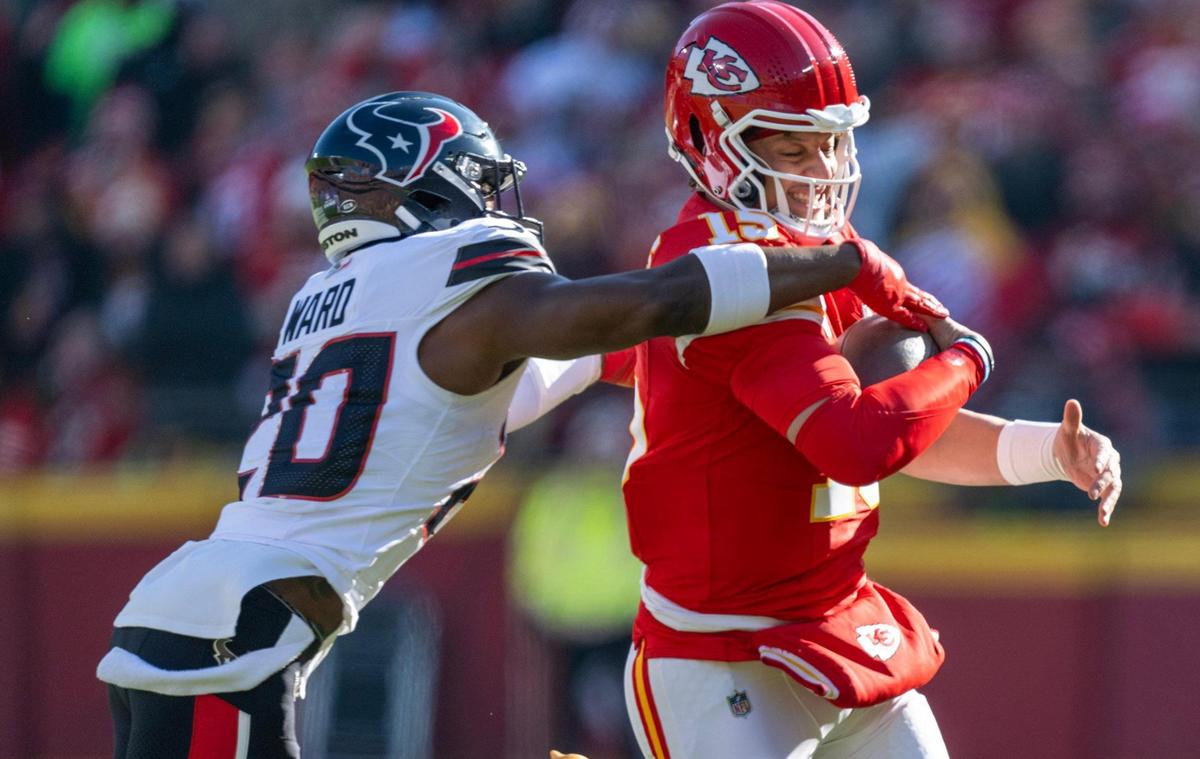 Houston Texans safety Jimmie Ward (20) pressures Kansas City Chiefs quarterback Patrick Mahomes (15) in the first half against at GEHA Field at Arrowhead Stadium on Saturday, Dec. 21, 2024.