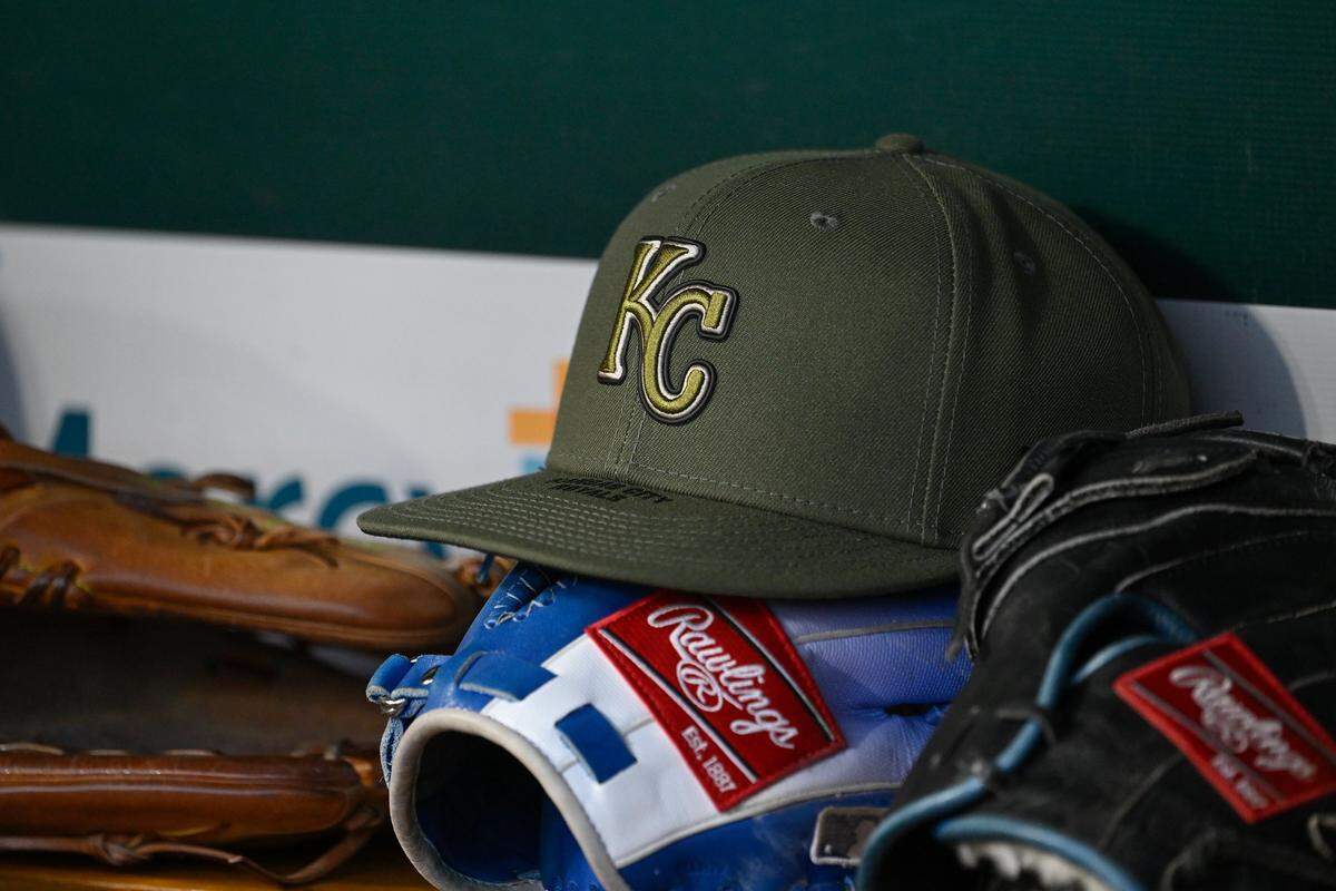 An Armed Forces Day Weekend-themed Kansas City Royals hat sits in the dugout during a game against the Cardinals at Busch Stadium in St. Louis on Friday, May 15, 2026.