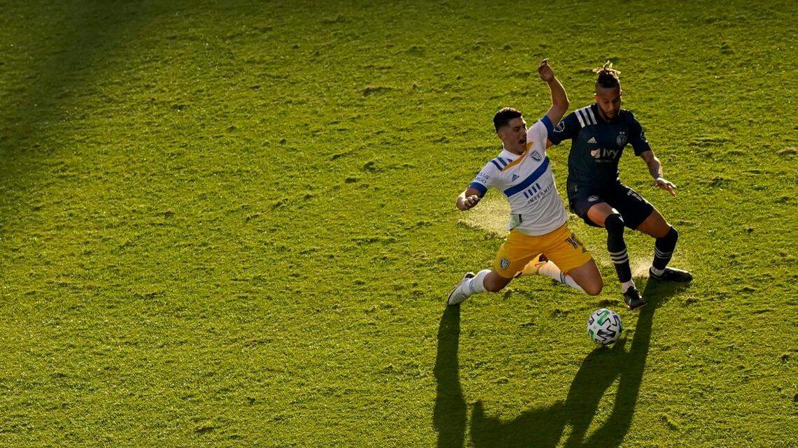 Sporting Kansas City defender Amadou Dia, right, battles San Jose Earthquakes forward Cristian Espinoza for the ball during an MLS Cup Playoffs opener Sunday afternoon at Children’s Mercy Park.