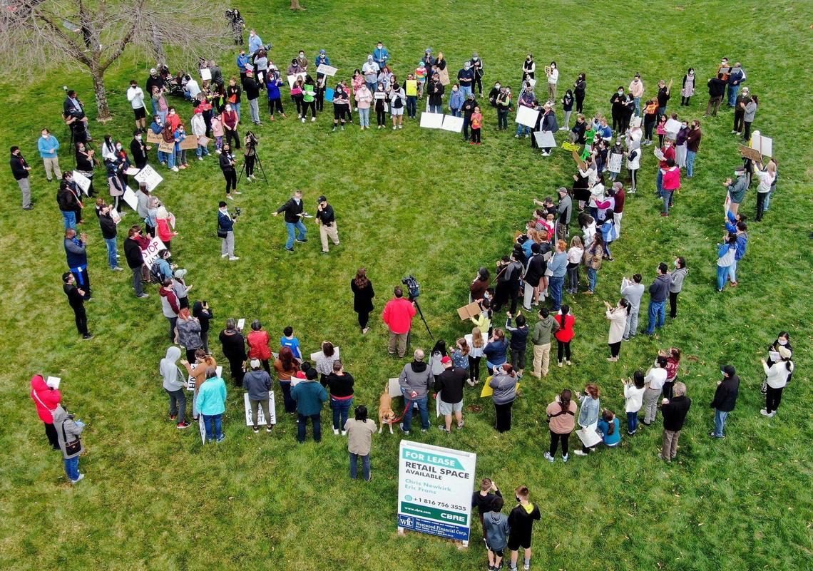 Nearly 150 people attended a rally at Highland Plaza on 119th Street in Overland Park Saturday, March 27, 2021, to bring attention to hate crimes committed against Asian people. A newly formed group, Allies Against Asian Hate, organized the event.