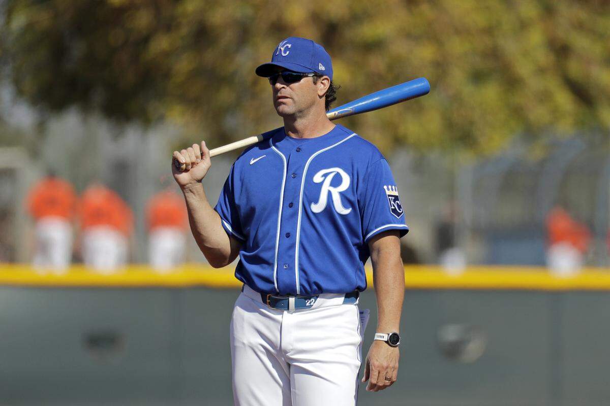 Kansas City Royals manager Mike Matheny watches from the outfield during baseball spring training Sunday, Feb. 16, 2020, in Surprise, Ariz. (AP Photo/Charlie Riedel)