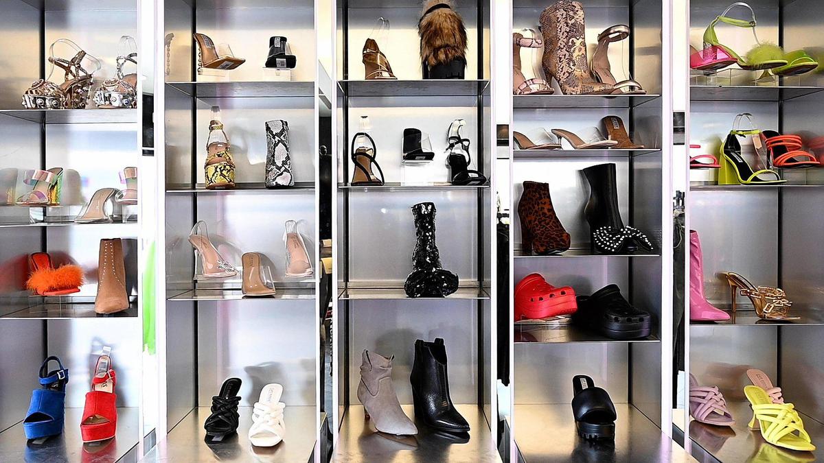 A shoe display fills a wall at Matches Boutique on the Country Club Plaza, offering an eclectic fashion mix, much of it from Los Angeles.