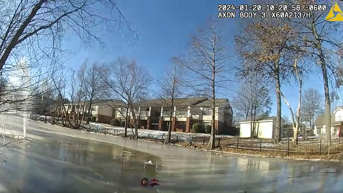 An Arkansas police officer rescued a child from a frozen pond. The child had fallen through the ice and was clinging to the edge, video shows. 