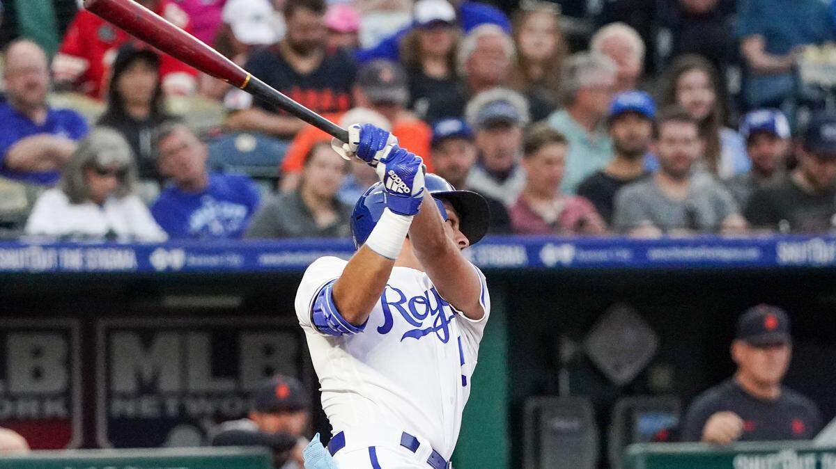 Kansas City Royals third baseman Nicky Lopez (8) hits a triple against the Detroit Tigers in the fifth inning at Kauffman Stadium on May 22, 2023.