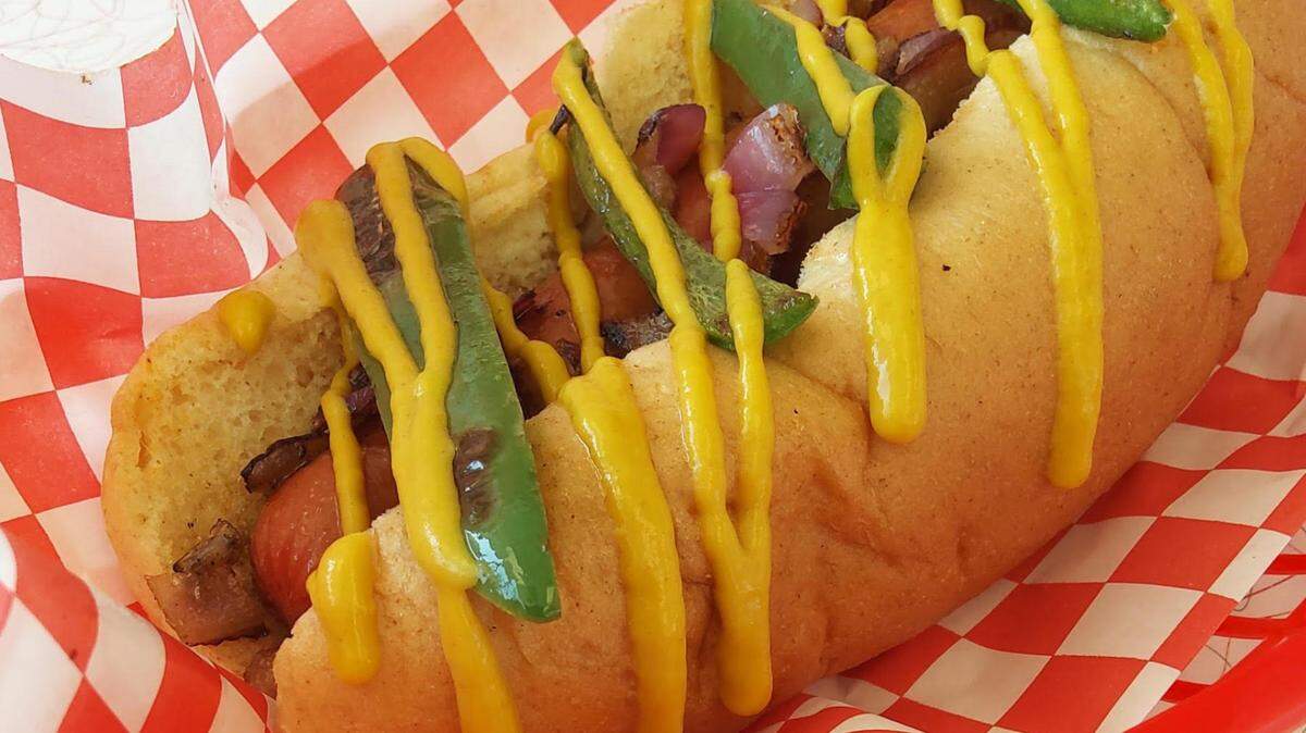 The Rio Dog ((bacon, onions, jalapenos, mustard and cream cheese), is one of several hot dogs at Independence restaurant Up Dog.