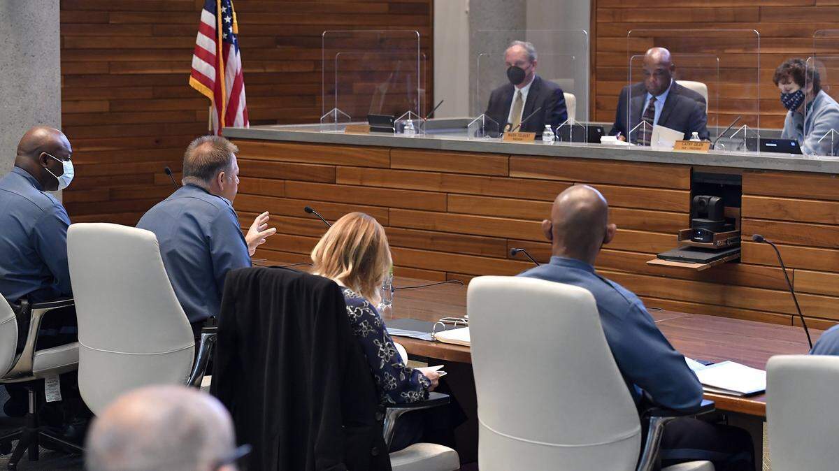 Former Kansas City Police Chief Rick Smith, left, spoke to the Board of Police Commissioners during a meeting at police headquarters downtown.