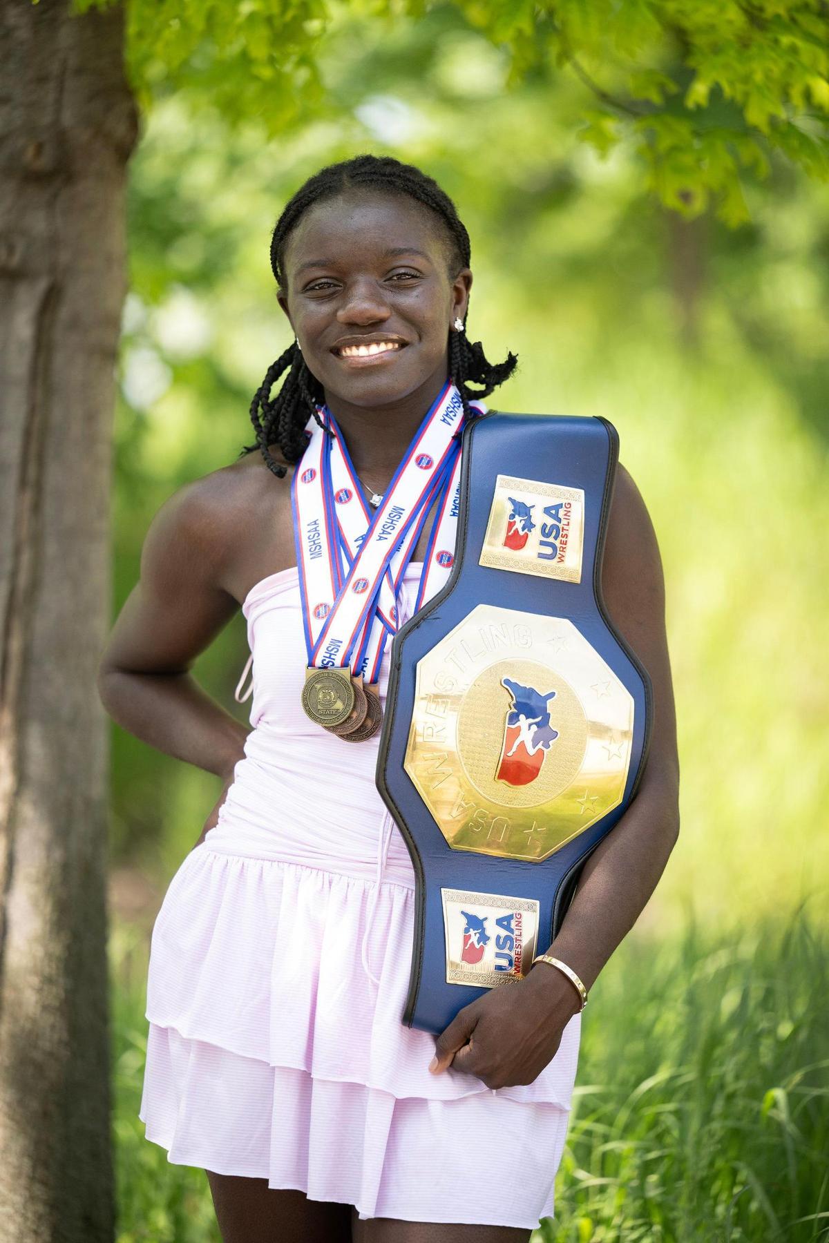 Louise Juitt, 18, a graduate of Belton High School, displays the wrestling belt she won at the 2025 Girls National High School Recruiting Showcase in Las Vegas. In addition to wrestling, Juitt also participates in cheerleading, track, cross country and golf.