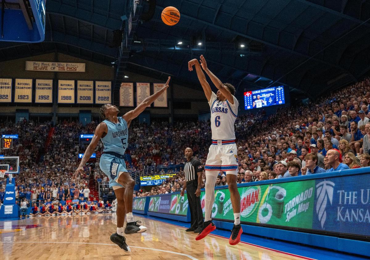 Kansas Jayhawks guard Rylan Griffen (6) shoots against the Washburn Ichabods’ Jacob Hanna (5) on Tuesday, Oct. 29, 2024, at Allen Fieldhouse in Lawrence.