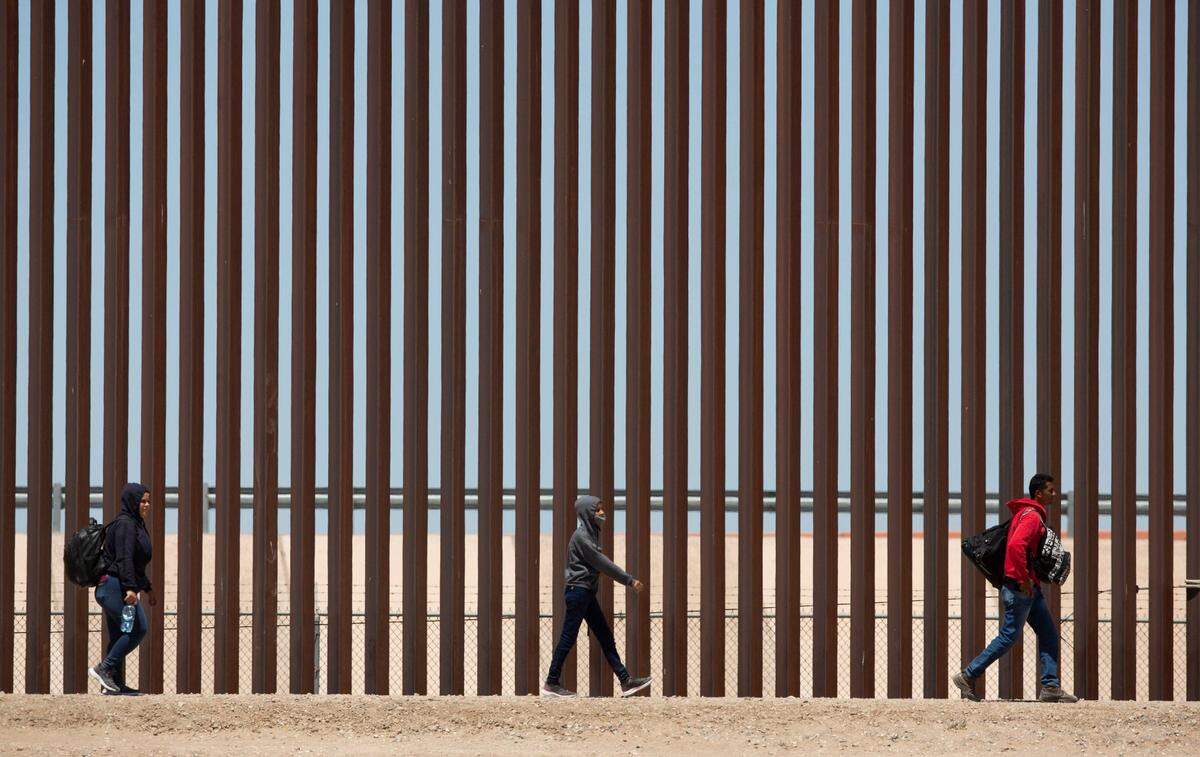 Migrants await to be processed after having crossed the Rio Grande from Ciudad Juarez in hopes of turning themselves in with the intention of seeking asylum.