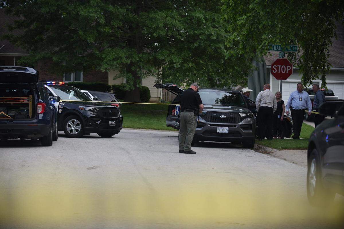 Detectives and crime scene investigators were at the scene of a triple shooting Thursday in the 1200 block of Oakwood Drive in Lee’s Summit that left two dead and a third in serious condition.