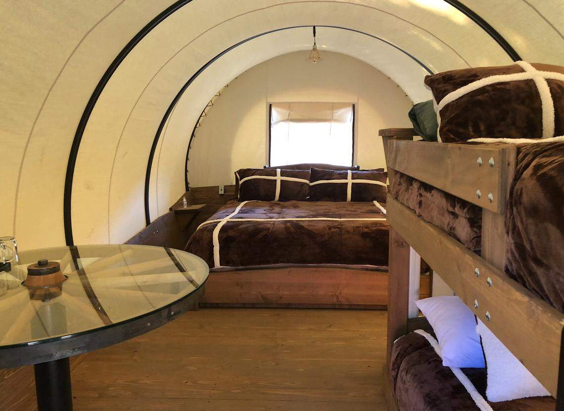 The interior of a “glamping” covered wagon at Yosemite Pines Resort. Courtesy of the resort.