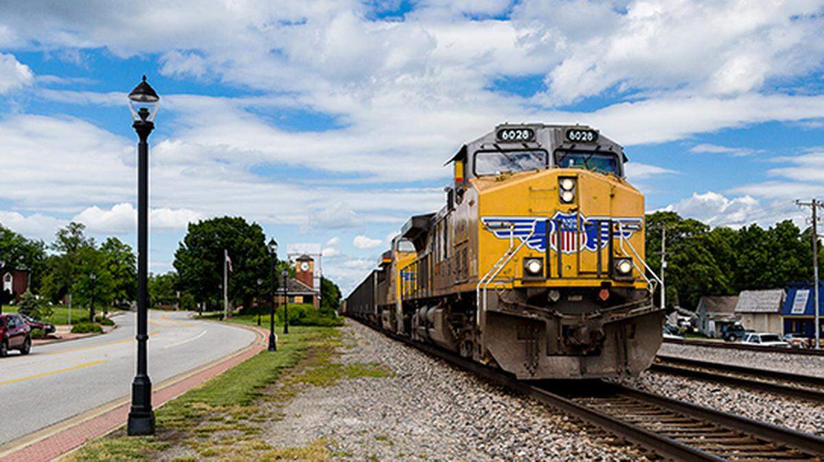 A BNSF rail crossings in Lexena, Kansas. Carriers and unions reached a tentative deal Thursday that avoids a strike and supply chain issues.