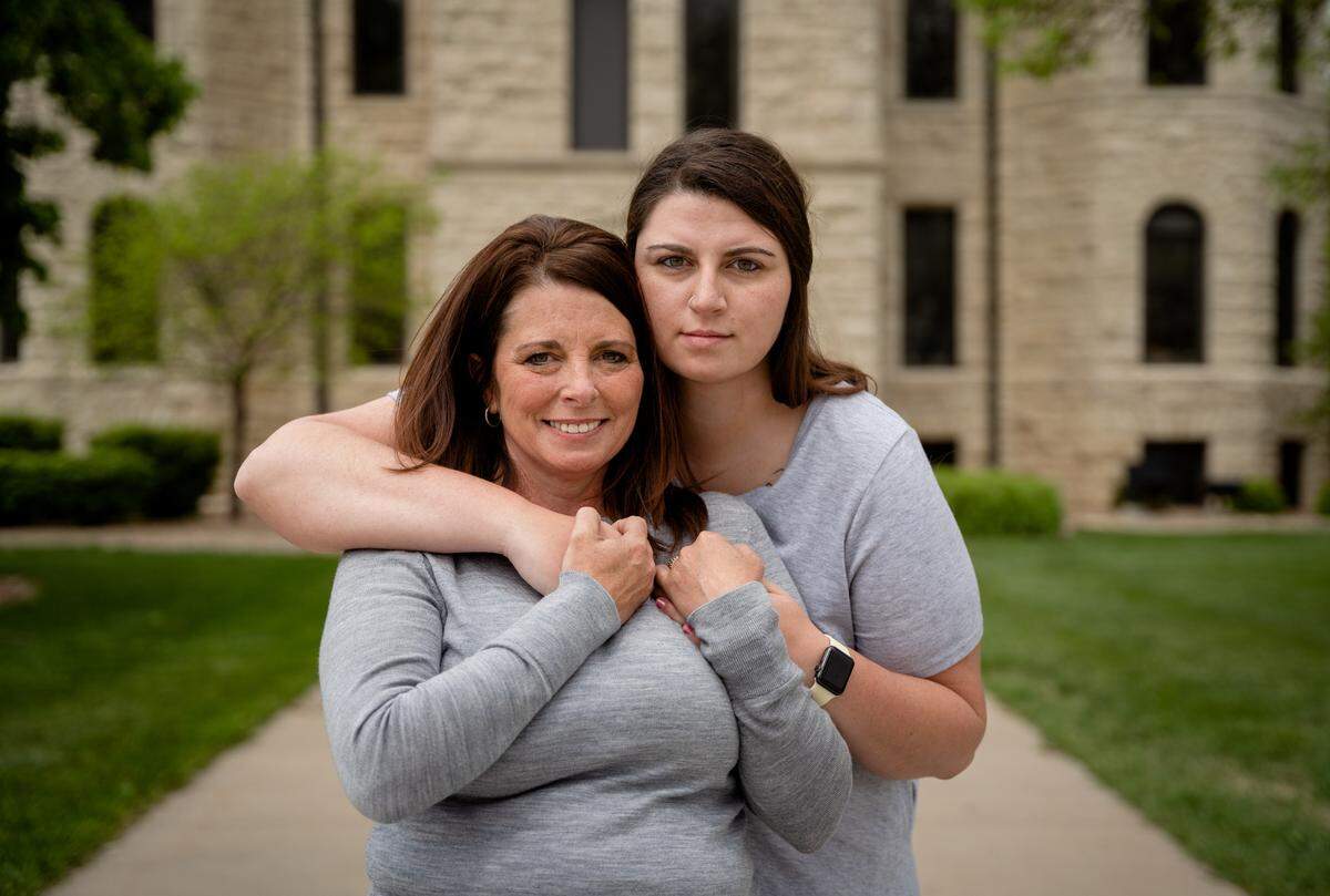Madison Smith and her mother, Mandy, in front of the McPherson County Courthouse, where a grand jury will hear her account of the assault she suffered as a college freshman.