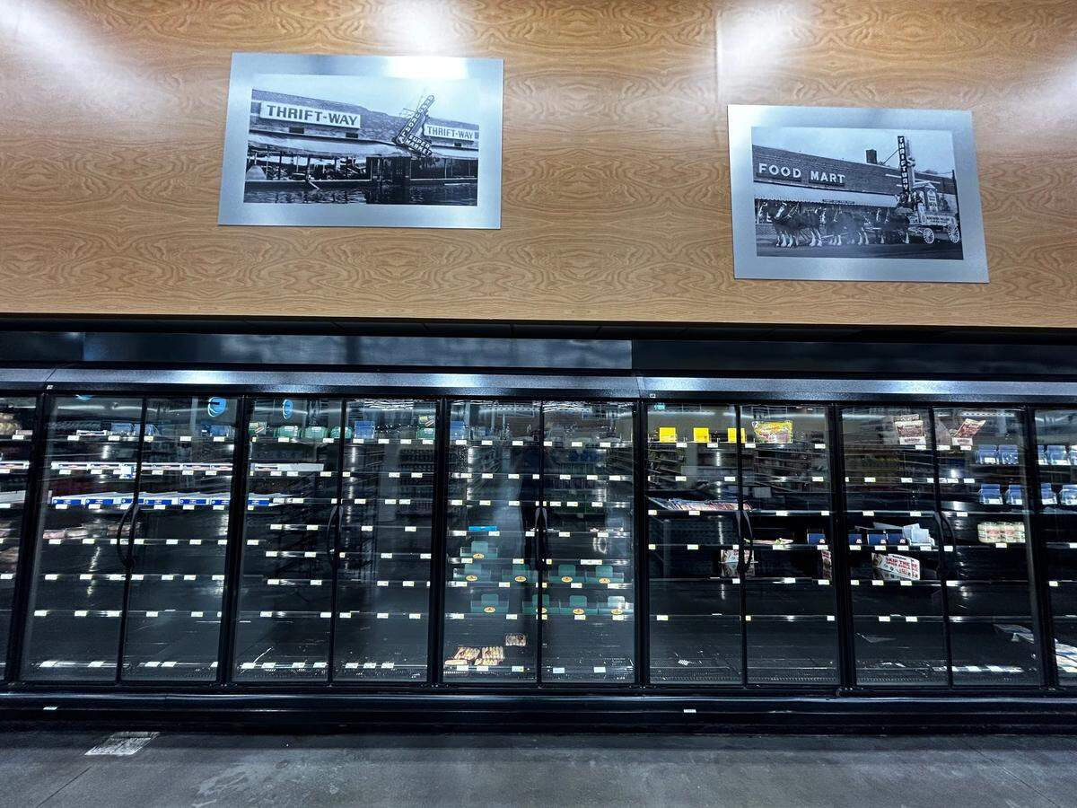 Empty meat refrigerators await customers at the city-owned Sun Fresh at 31st Street and Prospect Avenue.