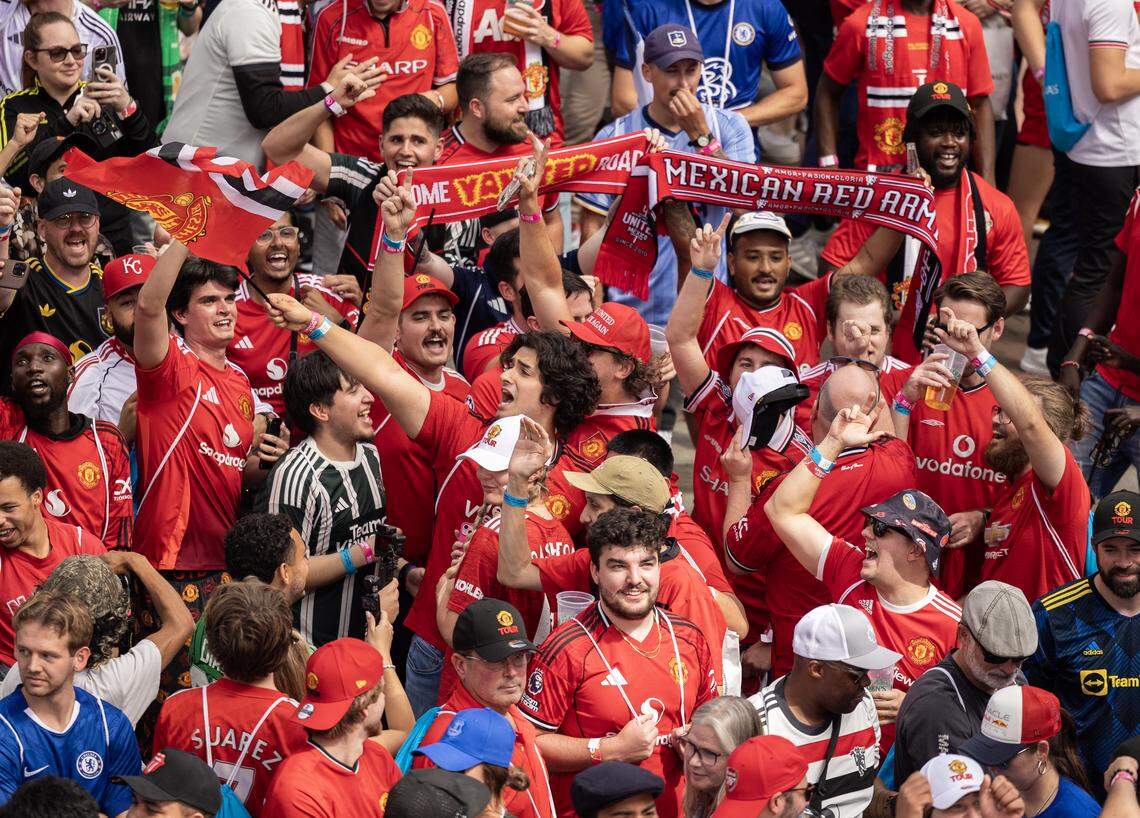 Manchester United fans celebrate in Kansas City’s Power & Light District on Saturday, Sept. 20, after watching their team beat Chelsea, 2-1.