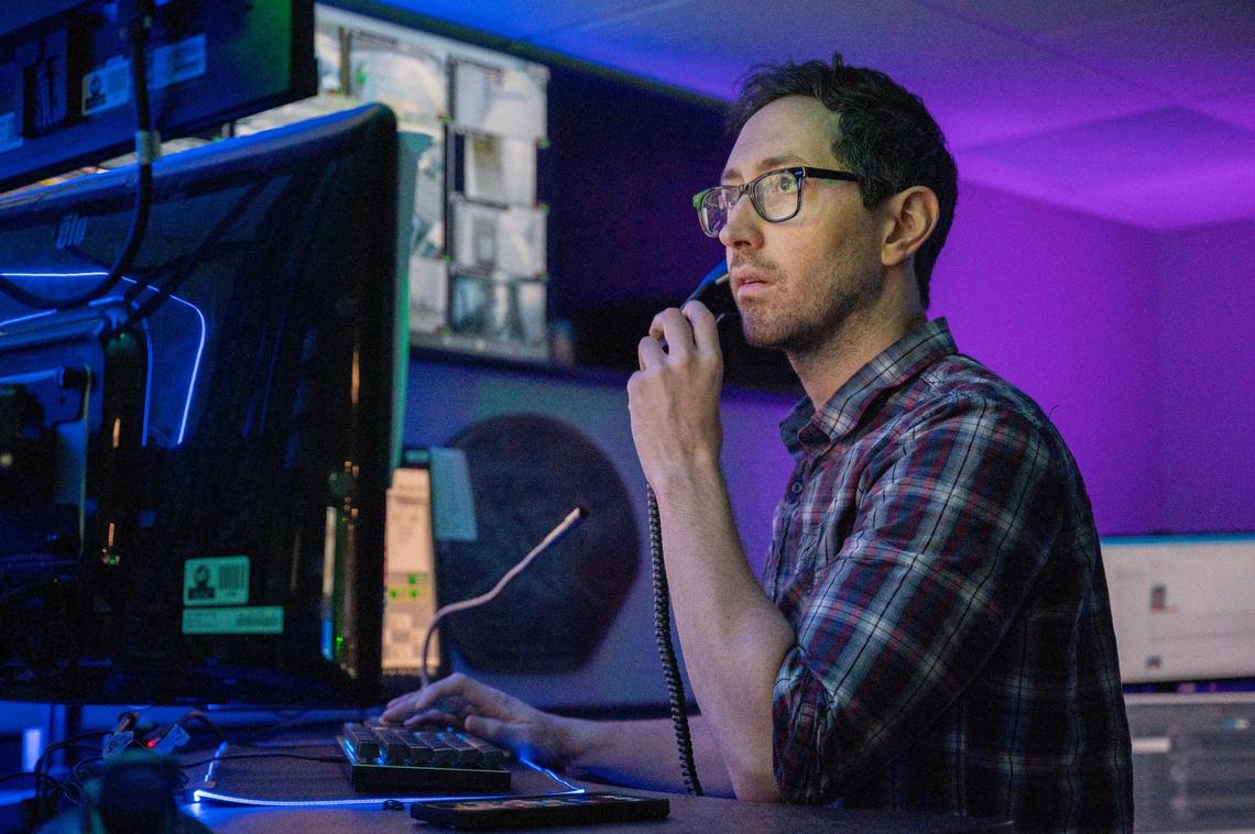 John Hilton, a dispatcher for Gladstone police, takes a call at the Gladstone consolidated dispatch center.