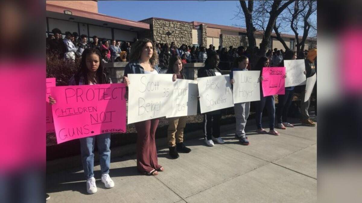 Grandview High School students were among hundreds in the Kansas City metropolitan area participating in a nationwide school walkout demonstration on Wednesday, March 14, 2018 to honor those injured and killed in a mass shooting at Marjory Stoneman Douglas High the month before. Students also held signs calling for stricter gun laws.