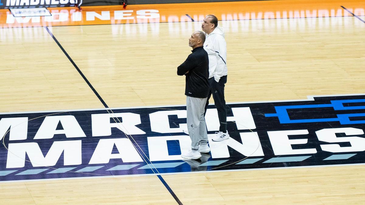 Acting Kansas coach Norm Roberts and assistant coach Kurtis Townsend watch their players during a team shootaround on March 15, 2023, ahead of a first-round game against Howard in the NCAA Tournament.