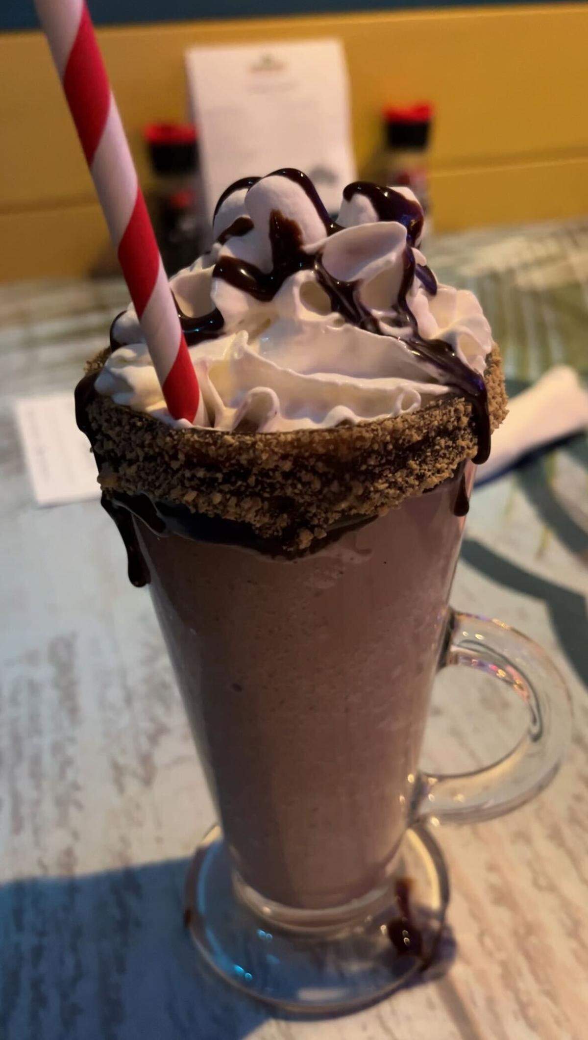 Chocolate Undertow is a frozen blend of pineapple-whipped vodka, white chocolate liquor, cocoa powder and hot fudge. 