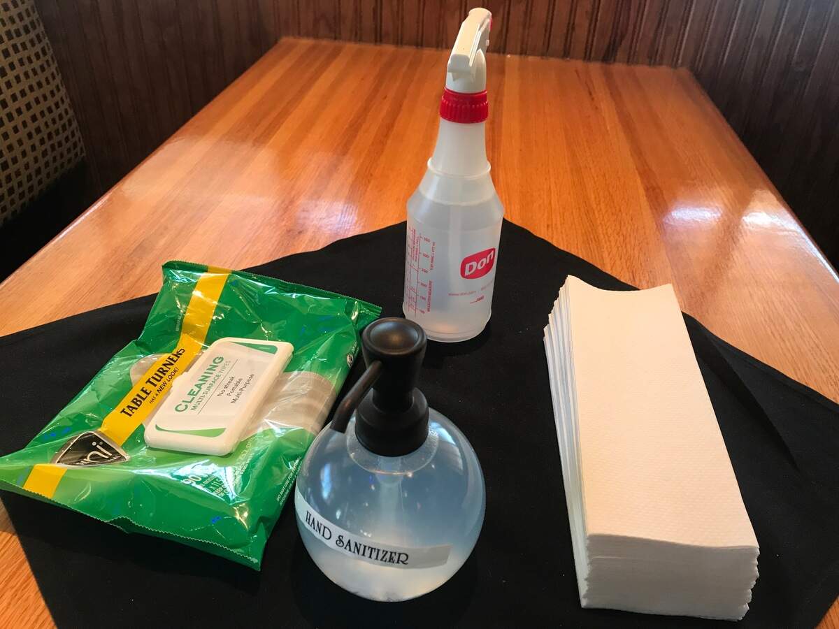 54th Street Grill & Bar in Zona Rosa keeps a selection of sanitizing supplies on closed tables.