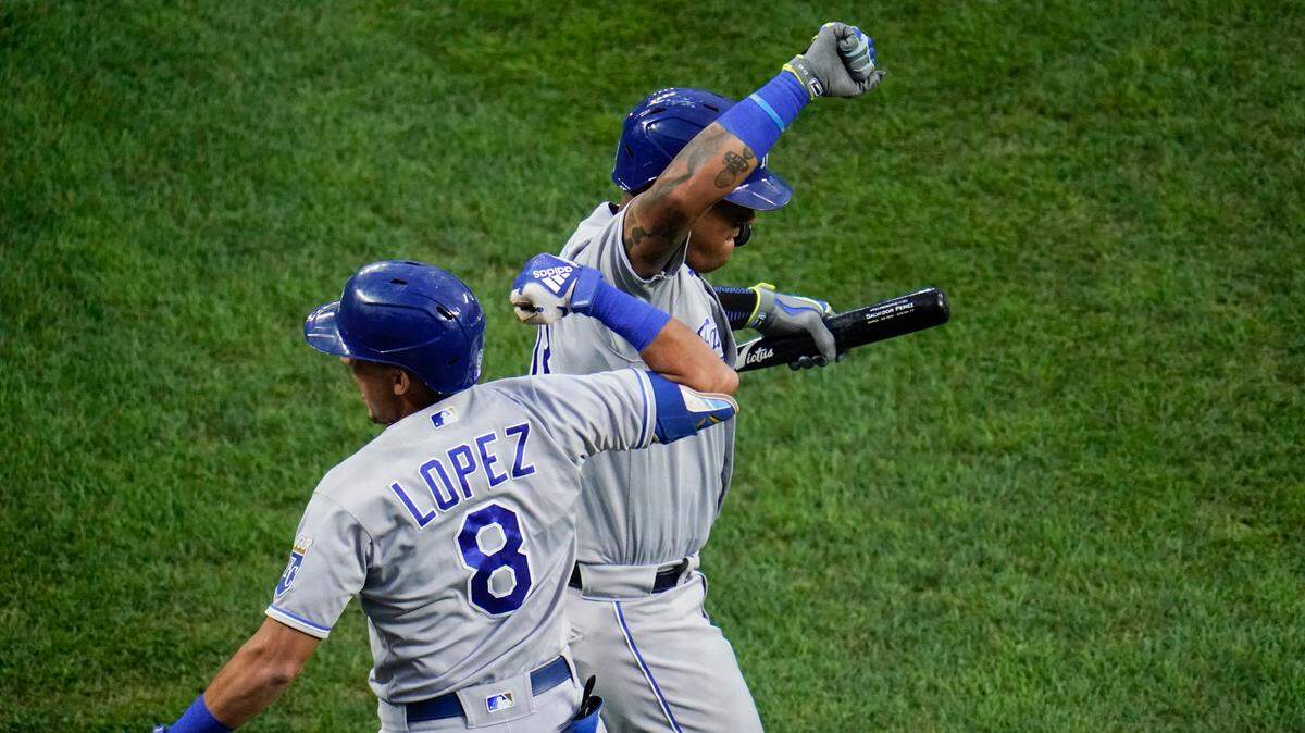 Kansas City Royals’ Nicky Lopez and Salvador Perez celebrate Lopez’s solo home run off Baltimore Orioles starting pitcher John Means during the first inning on Thursday, Sept. 9, 2021, in Baltimore.