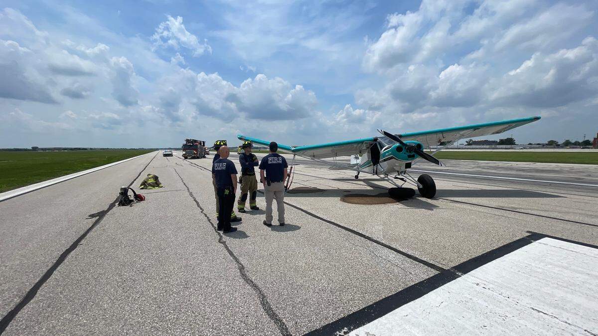 A small plane suffered damage to its wing and landing gear as a pilot landed at New Century Air Center Saturday. Crews from Fire District 1 of Johnson County cleaned a fuel leak caused in the crash