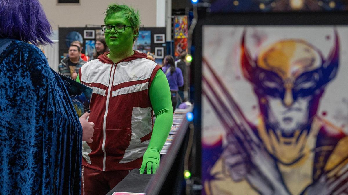 Logan Taylor, dressed as the character Beast Boy from the show “Young Justice,” attends the 25th anniversary of Planet Comicon at the Kansas City Convention Center on March 9, 2024, in Kansas City.