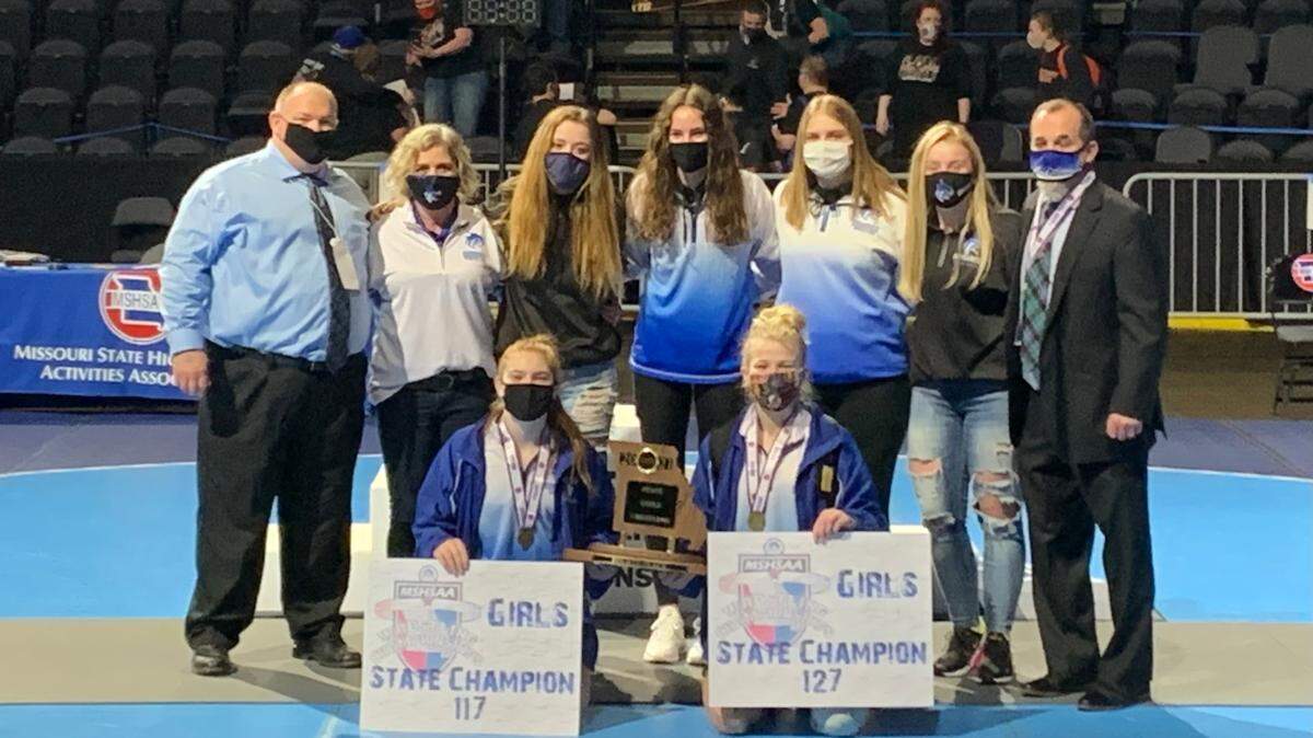 In this 2021 file photo, Harrisonville High girls wrestlers posed at state finals after placing fourth as a team.