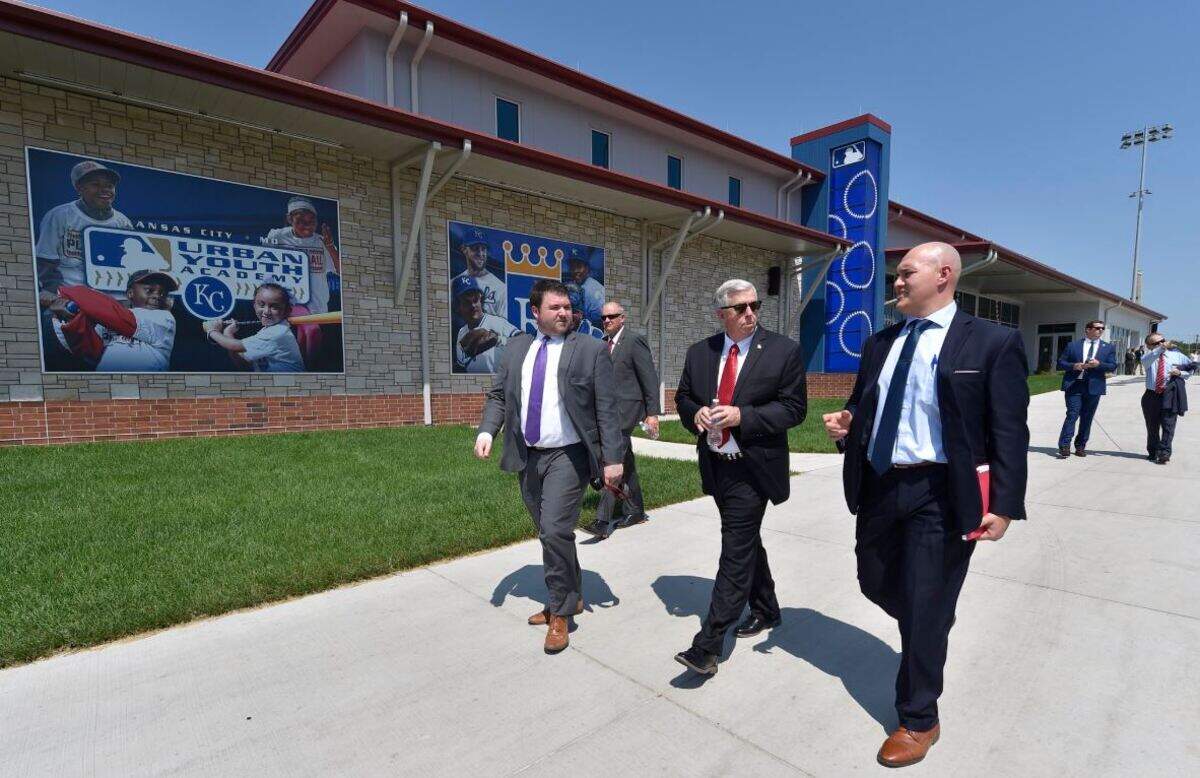 Missouri Gov. Mike Parson (center) was flanked by staff members while touring the MLB Urban youth Academy as part of his visit to Kansas City on Thursday, Aug. 2.