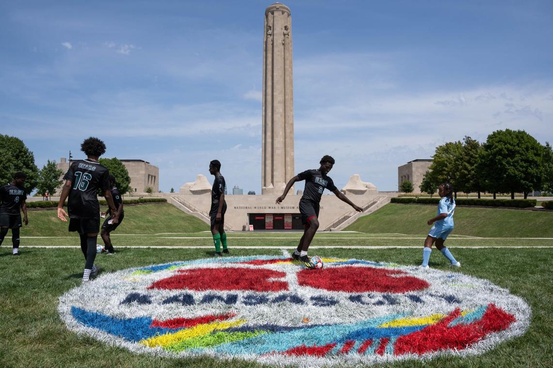 Players from the East High School soccer team kick a ball around at the National WWI Museum and Memorial on Wednesday, Aug 14, 2024. The venue was announced as the location of the of FIFA Fan Fest for the upcoming 2026 World Cup matches in Kansas City.