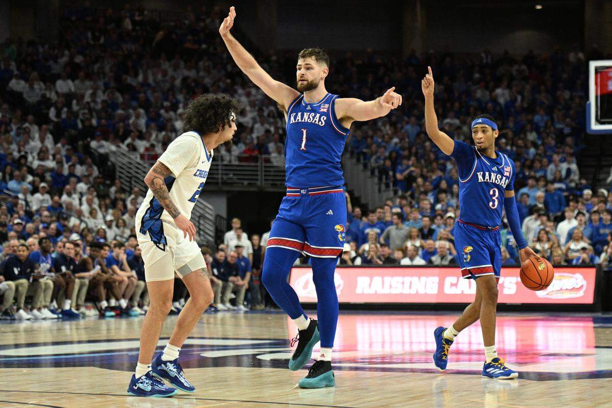 Kansas Jayhawks guard Dajuan Harris Jr. (3) signals against the Creighton Bluejays during the first half at CHI Health Center Omaha on Dec. 4, 2024.