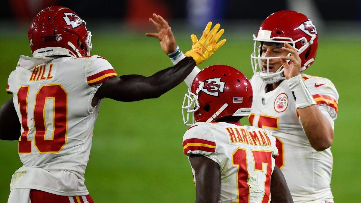 Chiefs wide receiver Tyreek Hill (No. 10) and quarterback Patrick Mahomes (15) celebrate after connecting for a touchdown Monday night on the road against the Baltimore Ravens.