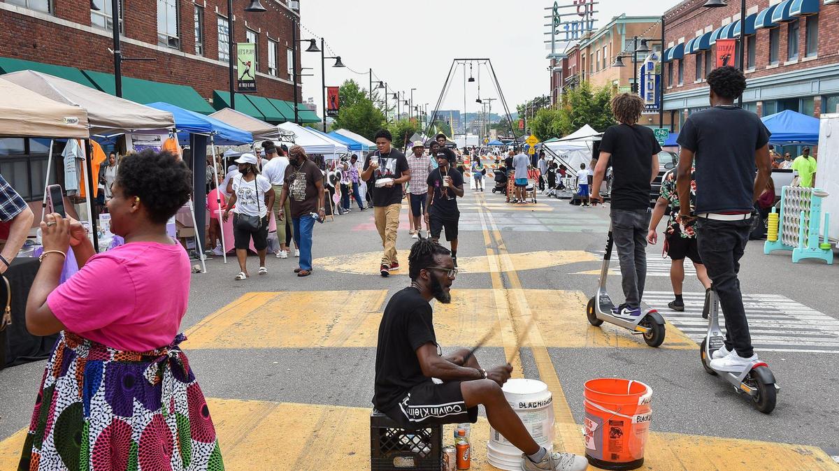 Ed “Bucketman” Humes plays his buckets on 18th Street during Kansas City’s Juneteenth Heritage Festival in the 18th and Vine Jazz District Saturday, June 19, 2021.