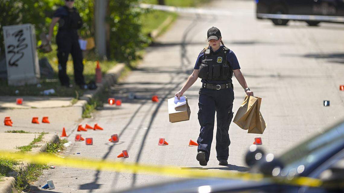 Police and crime scene investigators were on the scene collecting evidence where three people died and five were injured following a shooting early Sunday, June 25, 2023, near 57th Street and Prospect Avenue in Kansas City.