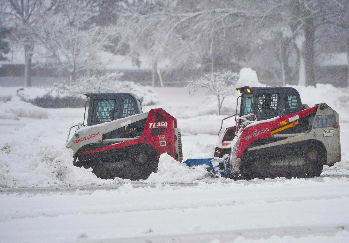 A snow plows cleared snow from the parking lots at Oak Park Mall in Overland Park on Tuesday, Jan. 9, 2024, after a winter storm dumped several inches of snow in the Kansas City area.