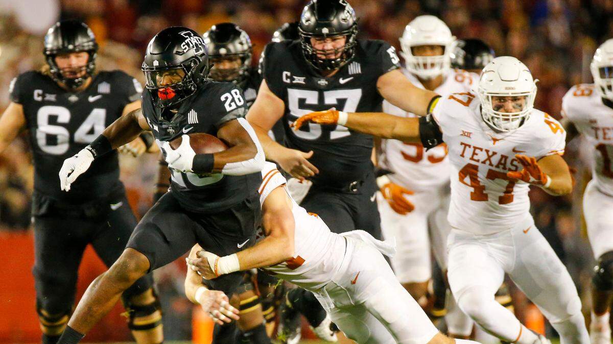 Iowa State Cyclones running back Breece Hall (28) runs the ball as the Longhorns take on the Cyclones in Ames, Saturday, Nov. 6, 2021. The Cyclones beat the Longhorns.