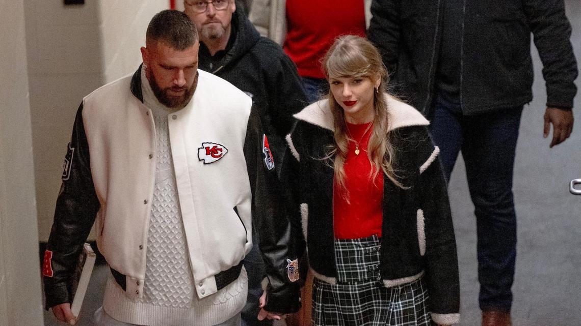 Pop star Taylor Swift holds hands with boyfriend and Kansas City Chiefs tight end Travis Kelce as they leave Arrowhead Stadium after an NFL football game on Monday, Dec. 25, 2023, in Kansas City.