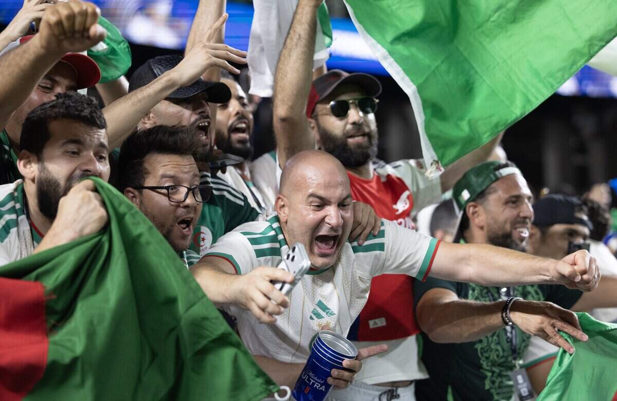 Algerian fans celebrate their team's draw against Austria to advance to the round of 31after a FIFA World Cup group-stage soccer match at Kansas City (Arrowhead) Stadium in Kansas City on Saturday, June 27, 2026.