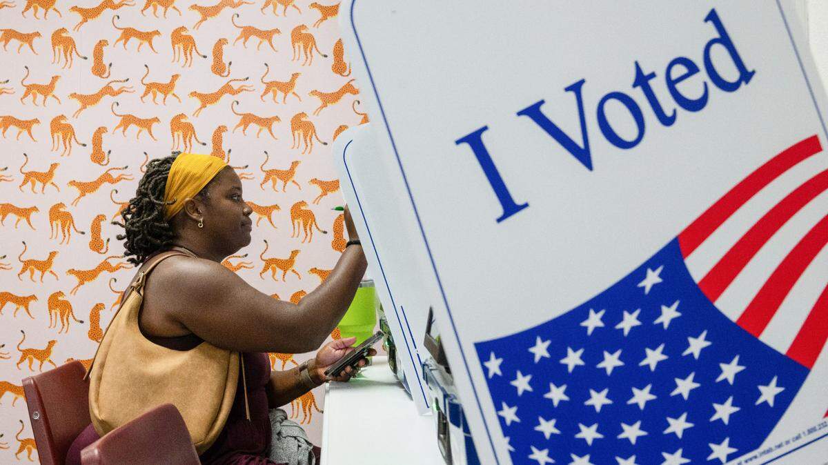 Erica Wilson of Lee’s Summit fills out out an electronic ballot Tuesday during early voting at the Jackson County Election Board polling station in Independence.