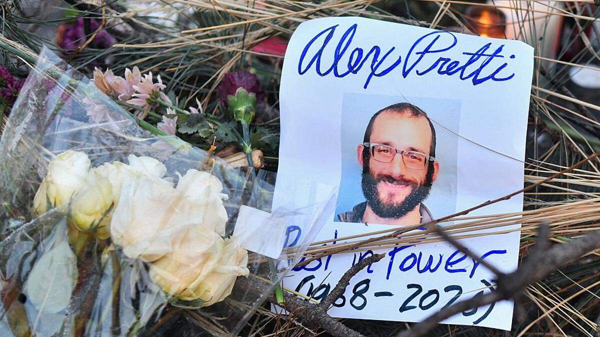 Flowers are left at a makeshift memorial in the area where Alex Pretti was shot dead a day earlier by federal immigration agents in Minneapolis, Minnesota, on January 25, 2026. On January 24, federal agents shot dead US citizen Alex Pretti, a 37-year-old ICU nurse, while scuffling with him on an icy roadway, less than three weeks after an immigration officer shot and killed Renee Good, also 37, in her car.
His killing sparked new protests and impassioned demands by local leaders for the Trump administration to end its operation in the city. (Photo by Octavio JONES / AFP via Getty Images)