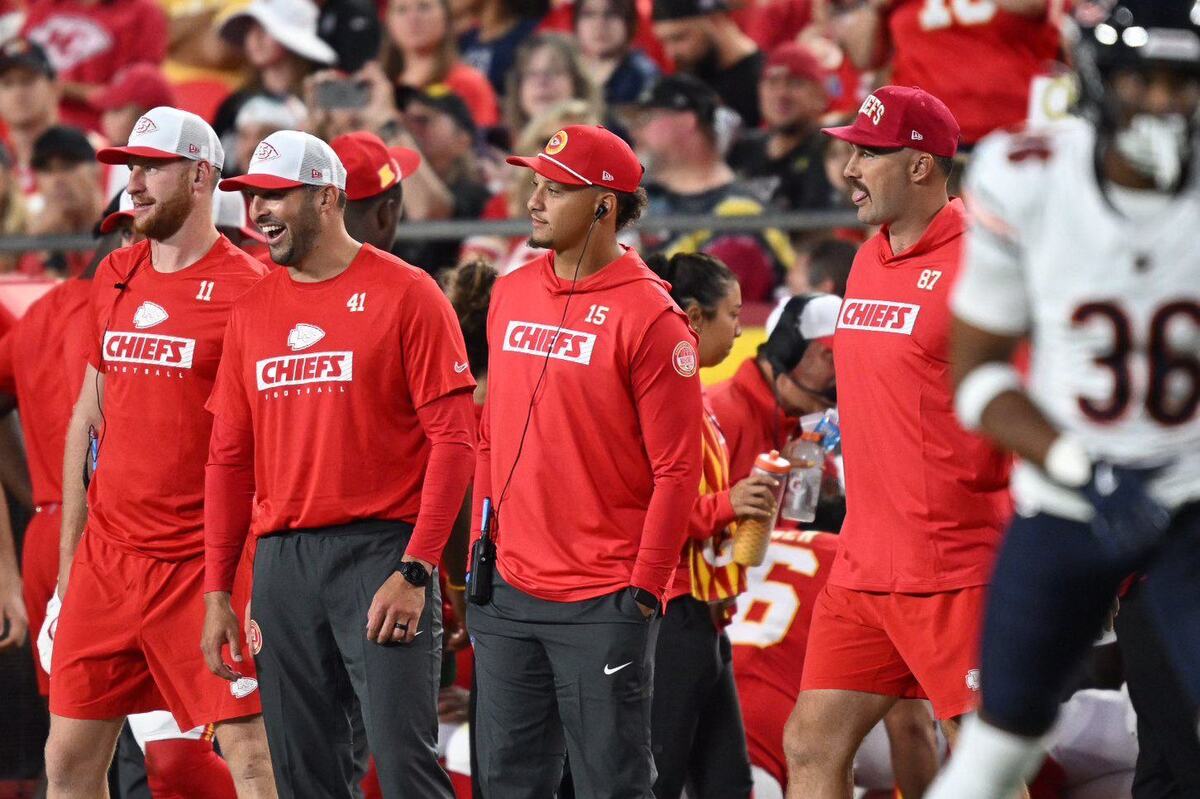 Kansas City Chiefs players quarterback Carson Wentz (11), long snapper James Winchester (41), quarterback Patrick Mahomes (15) and tight end Travis Kelce (87) watched from the sidelines Thursday while mostly non-starters played the Chicago Bears.