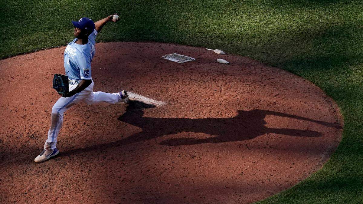 Kansas City Royals center fielder Michael A. Taylor pitches during the eighth inning of a baseball game against the Cleveland Guardians Saturday, July 9, 2022, in Kansas City, Mo. The Guardians won 13-1. (AP Photo/Charlie Riedel)
