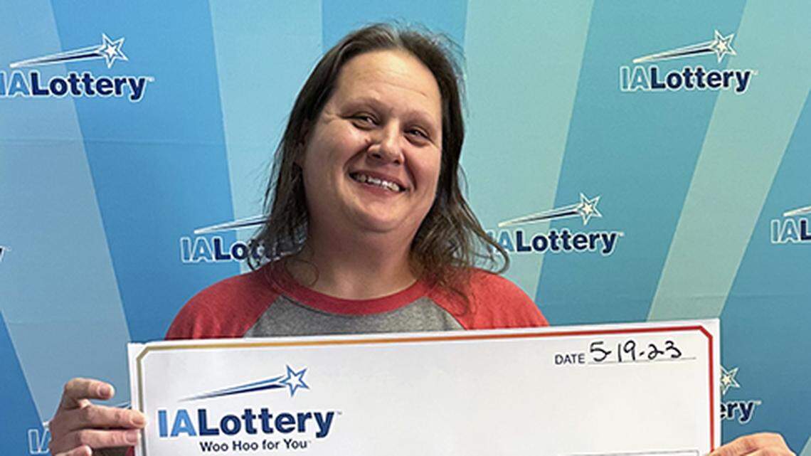 Heather Pierson with her oversized check.