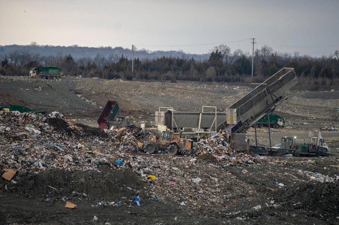 A trailer unloads a pile of debris at the Waste Management landfill facility on Thursday, March 16, 2023, in Kansas City, Kan.